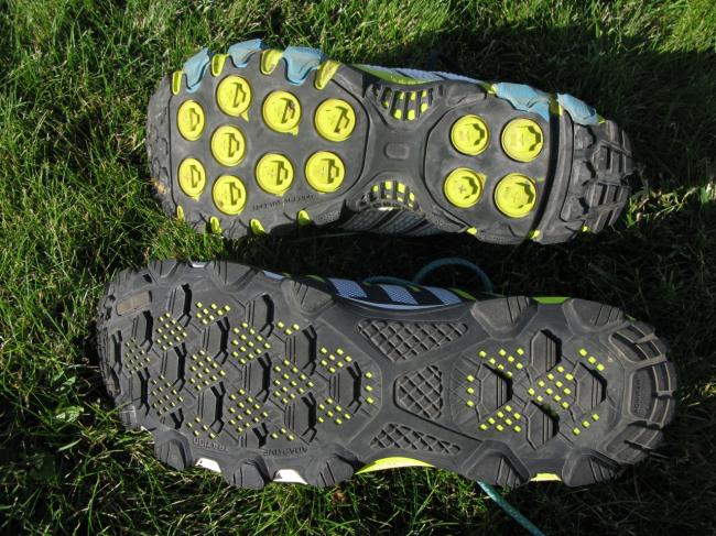 Raven 3 on top, notice round yellow lugs; these depress under pretty low pressure and are a part of adidas' "adaptive traxion" system more on that below; Riot 6 on bottome with a light, due to the cutouts, but very sticky all purpose outsole a high point of the Riot for me